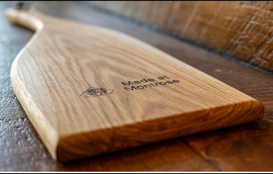 Handmade hardwood serving boards showing natural timber grain and smooth hand-finished surfaces, crafted by Made at Montrose in Lancashire.