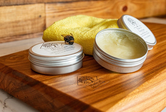 Made at Montrose Wood Butter in 100ml tins, a beeswax-based conditioner for nourishing and protecting wooden chopping boards .